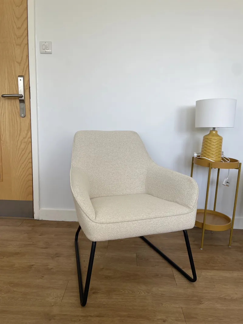 Cream Upholstered Armchair with Black Metal Legs