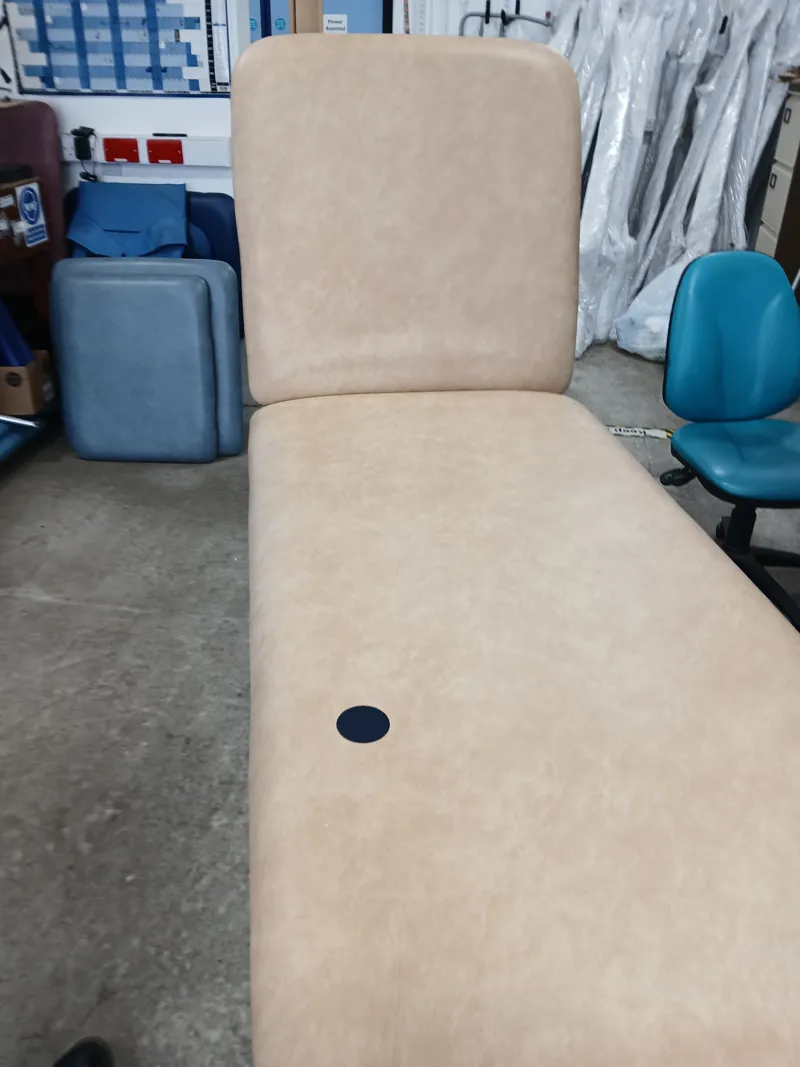 White Metal Examination Couch with Cream Upholstery